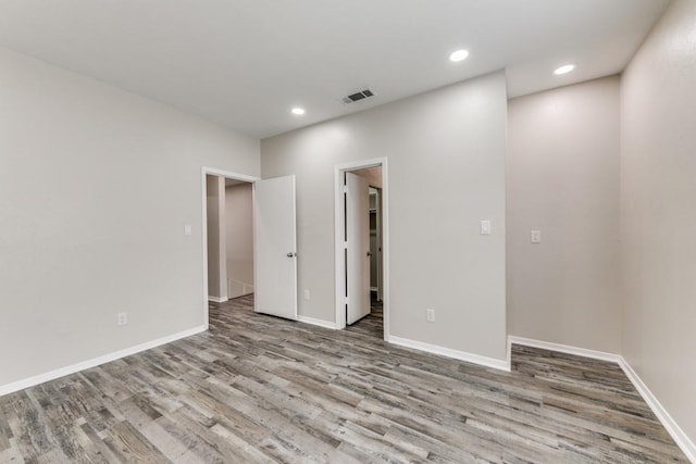 unfurnished room with light hardwood / wood-style flooring