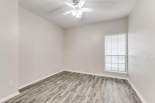 unfurnished room with ceiling fan and light wood-type flooring