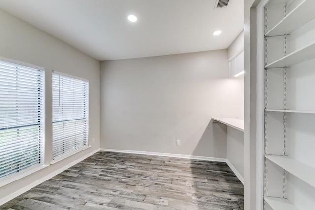 spare room featuring hardwood / wood-style flooring