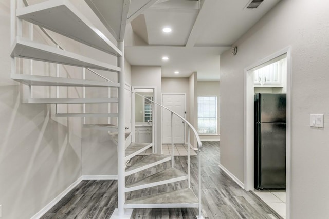 staircase with wood-type flooring