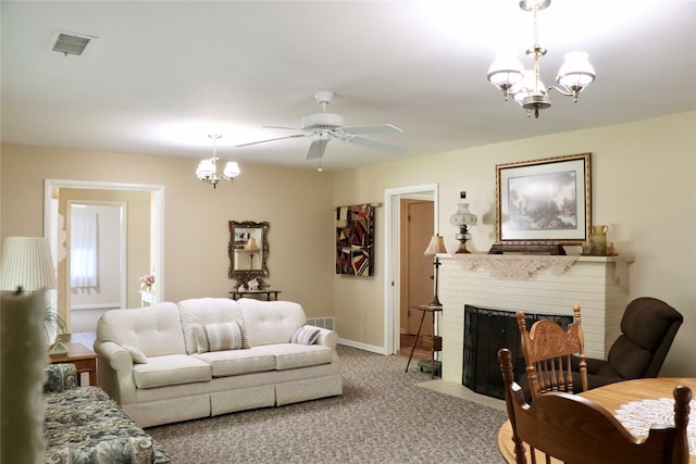 living room featuring carpet, a brick fireplace, and ceiling fan with notable chandelier