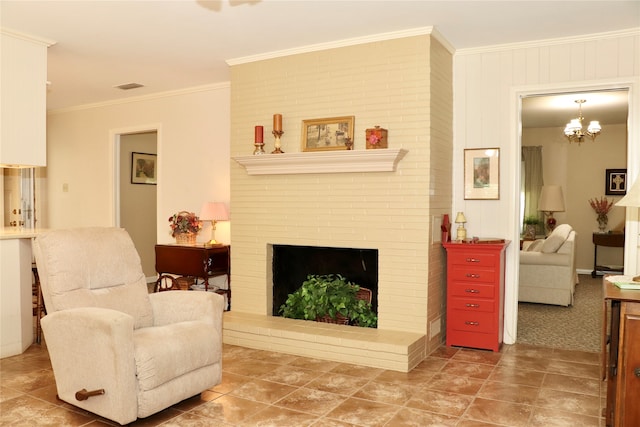 living room featuring crown molding, a brick fireplace, and an inviting chandelier