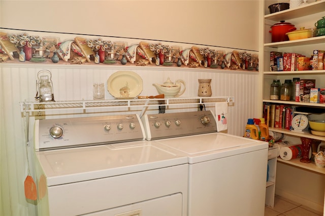 laundry area featuring tile patterned floors and separate washer and dryer