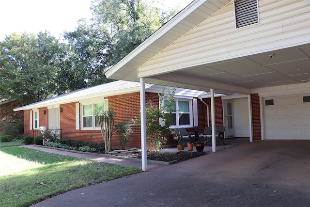 view of front facade with a carport and a front lawn