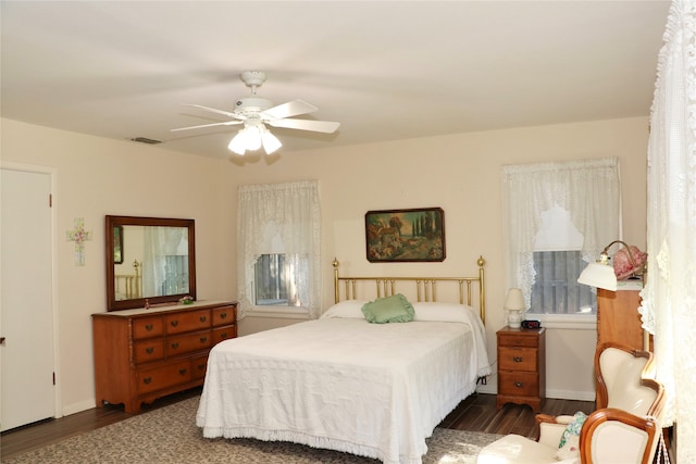 bedroom featuring dark wood-type flooring and ceiling fan