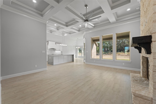 unfurnished living room with crown molding, light hardwood / wood-style flooring, a fireplace, and ceiling fan