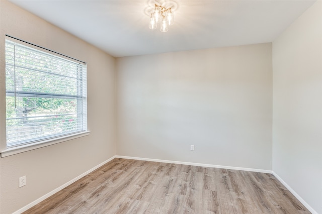 unfurnished room featuring light wood-type flooring