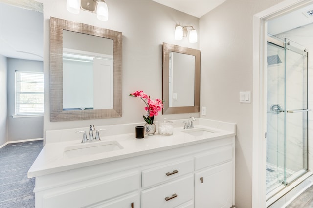 bathroom with vanity and walk in shower