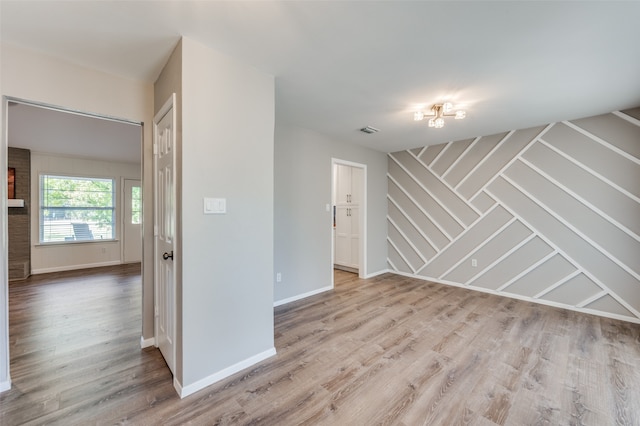 empty room with light wood-type flooring