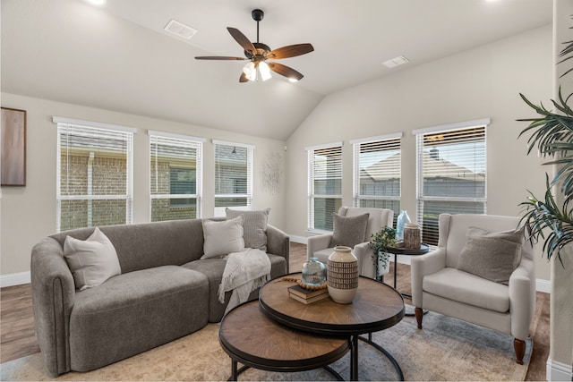 living room with vaulted ceiling, light wood-type flooring, and ceiling fan