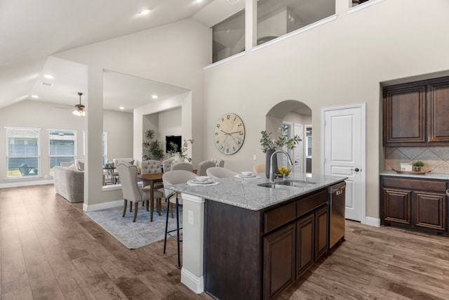 kitchen featuring dishwasher, sink, an island with sink, hardwood / wood-style floors, and ceiling fan