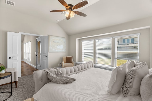 bedroom featuring ceiling fan, wood-type flooring, and lofted ceiling