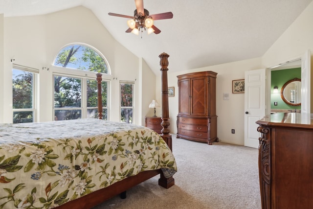 bedroom with light colored carpet, high vaulted ceiling, and ceiling fan