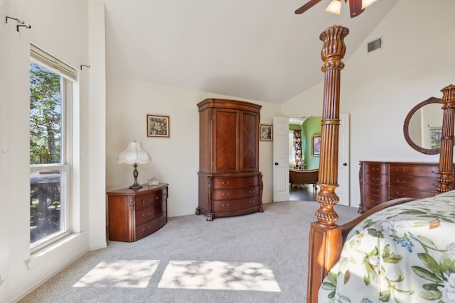 bedroom with light carpet, multiple windows, high vaulted ceiling, and ceiling fan