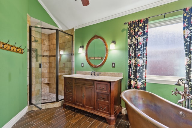 bathroom featuring vanity, independent shower and bath, lofted ceiling, and ornamental molding