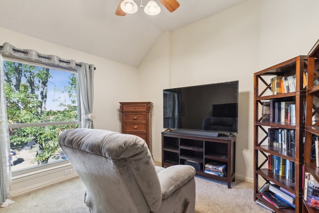 carpeted office featuring lofted ceiling and ceiling fan