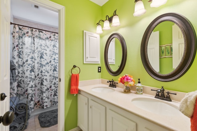 bathroom with vanity, a shower with curtain, and tile patterned flooring