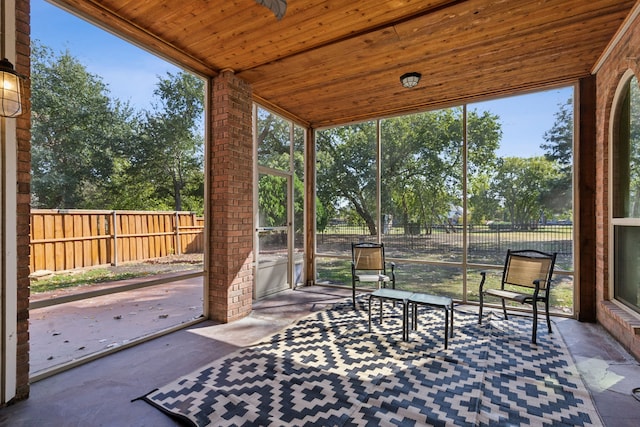 sunroom with wooden ceiling