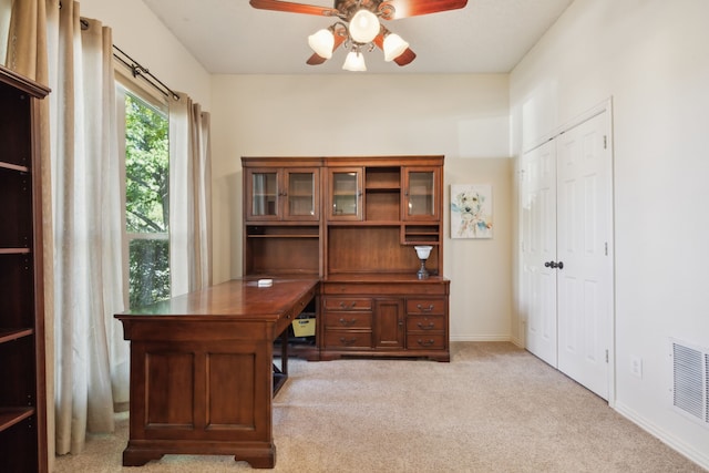 office area featuring light colored carpet and ceiling fan