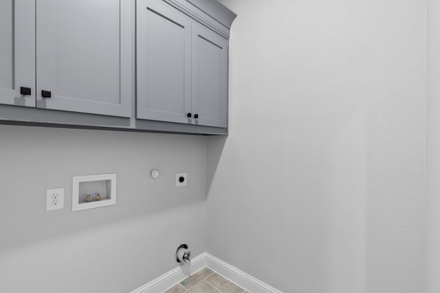 laundry room featuring cabinets, washer hookup, light tile patterned floors, hookup for a gas dryer, and hookup for an electric dryer