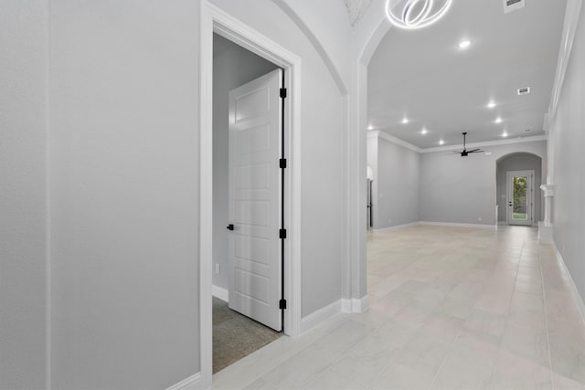 hallway featuring ornamental molding