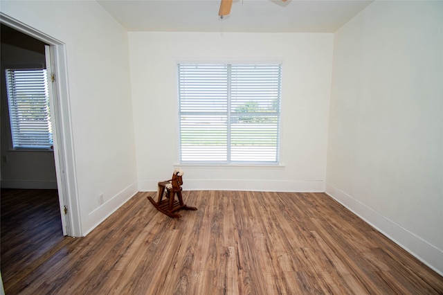 empty room featuring dark hardwood / wood-style floors and ceiling fan