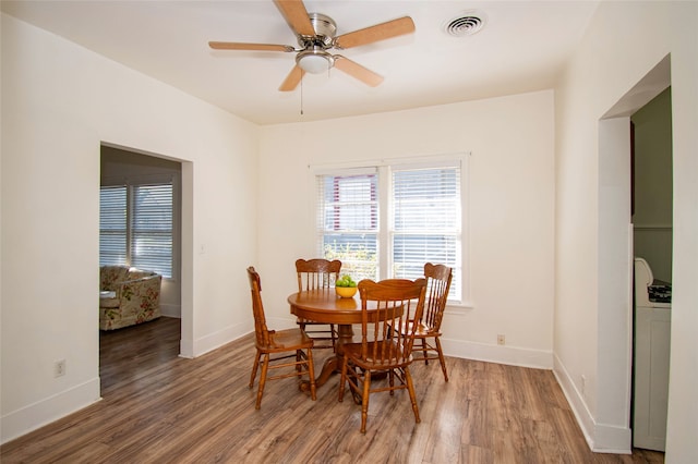 dining area featuring ceiling fan and hardwood / wood-style floors