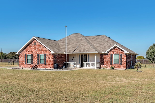 single story home featuring a front lawn and covered porch