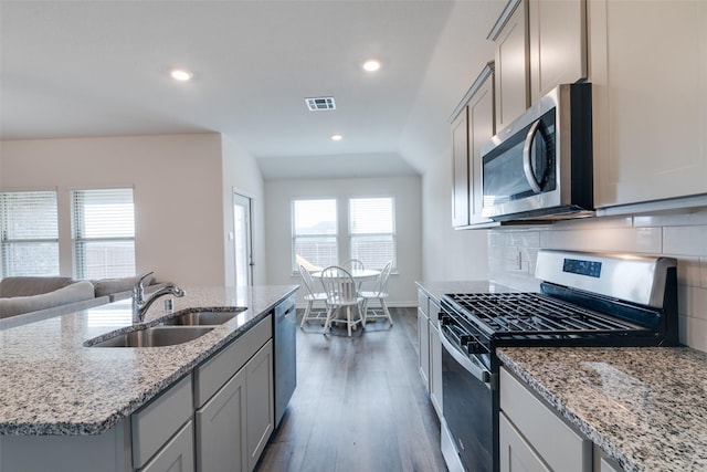 723 Cherish Day Dr, Lavon, TX 75166 - kitchen with appliances with stainless steel finishes, a sink, gray cabinets, wood finished floors, and recessed lighting