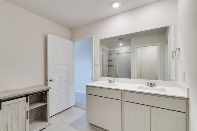 bathroom with vanity, tile patterned floors, and an enclosed shower