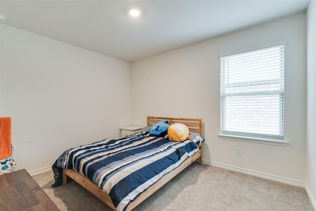 723 Cherish Day Dr, Lavon, TX 75166 - bedroom featuring carpet, multiple windows, and baseboards