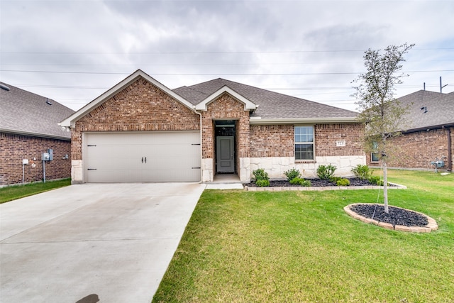 single story home featuring a front yard and a garage