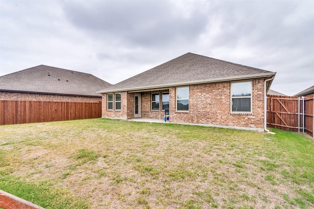 723 Cherish Day Dr, Lavon, TX 75166 - rear view of property featuring brick siding, roof with shingles, and a patio area