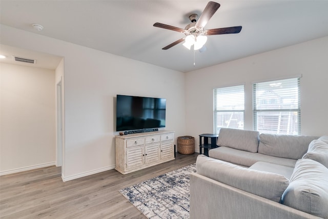 723 Cherish Day Dr, Lavon, TX 75166 - living area featuring light wood-style floors, a ceiling fan, and baseboards