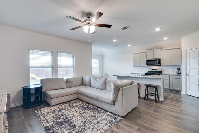 723 Cherish Day Dr, Lavon, TX 75166 - living area featuring a ceiling fan, wood finished floors, recessed lighting, and baseboards