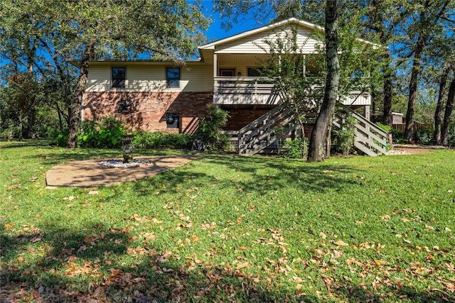 rear view of house with a lawn