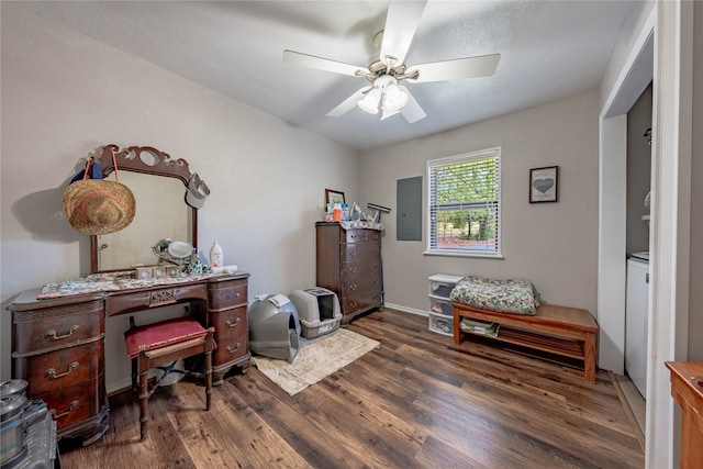 interior space with ceiling fan, electric panel, and dark hardwood / wood-style floors