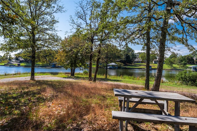 surrounding community with a water view