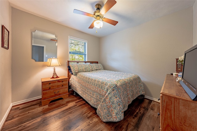 bedroom with dark wood-type flooring and ceiling fan