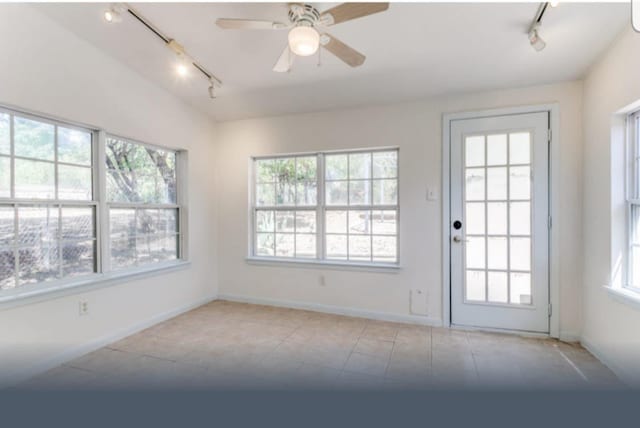 interior space featuring ceiling fan, a healthy amount of sunlight, and track lighting