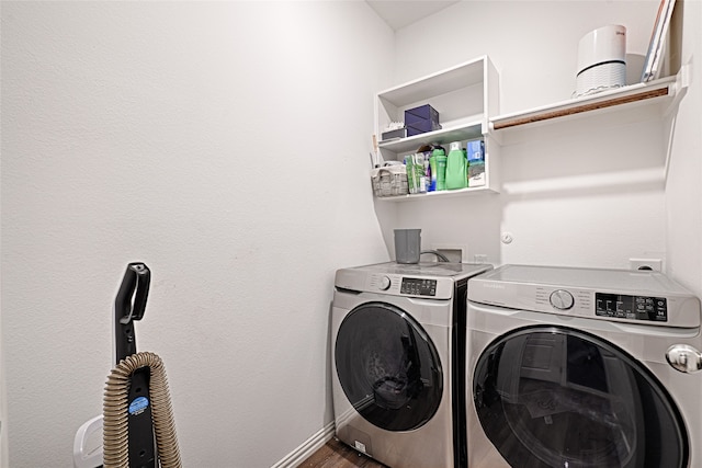 laundry area featuring independent washer and dryer and hardwood / wood-style flooring