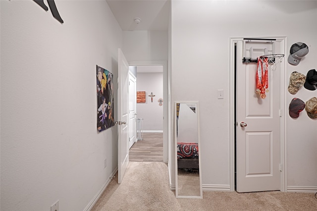 corridor with light colored carpet