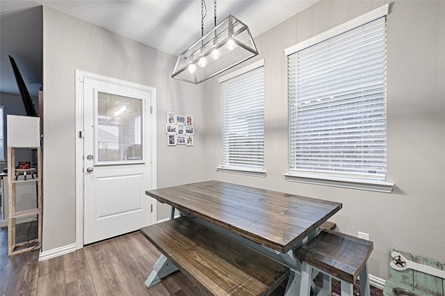 dining space featuring wood-type flooring