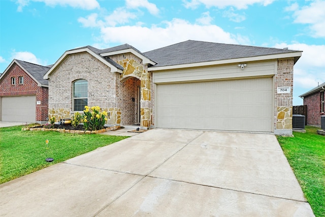 ranch-style home featuring a front yard and a garage