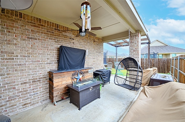 view of patio featuring ceiling fan