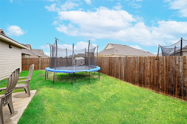 view of yard featuring a trampoline