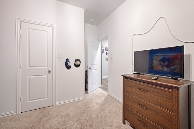 bedroom with light carpet