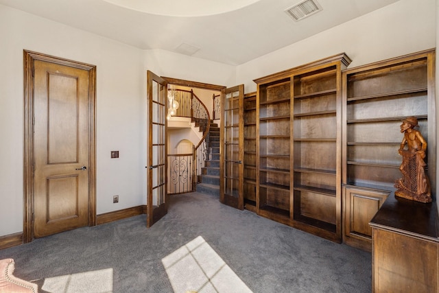1240 Concho Trl, Prosper, TX 75078 - unfurnished bedroom with french doors and dark carpet