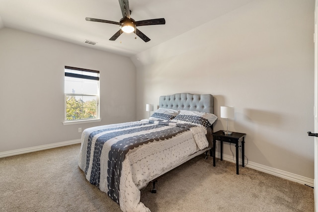 carpeted bedroom featuring ceiling fan and vaulted ceiling