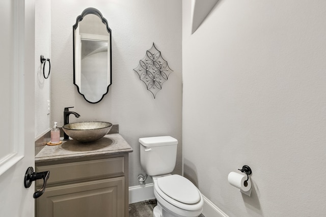 bathroom with toilet and vanity